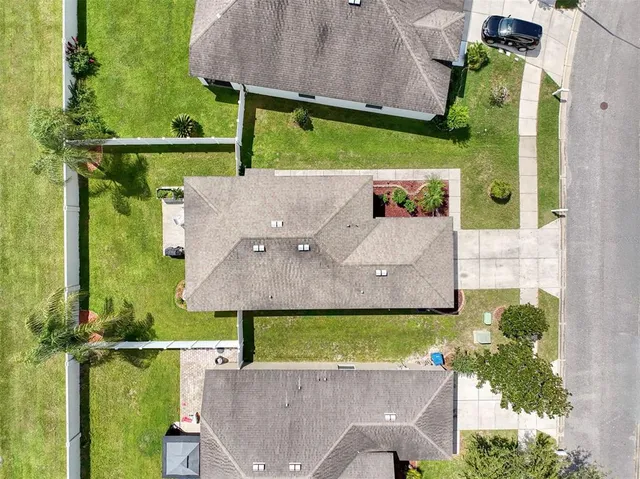 an aerial view of residential house with outdoor space and swimming pool