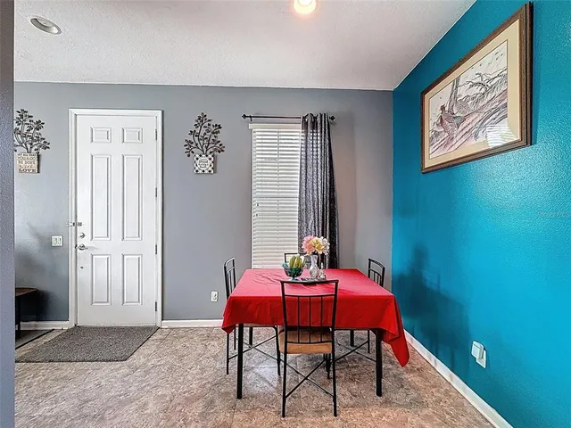 a view of a hallway with furniture and a large window