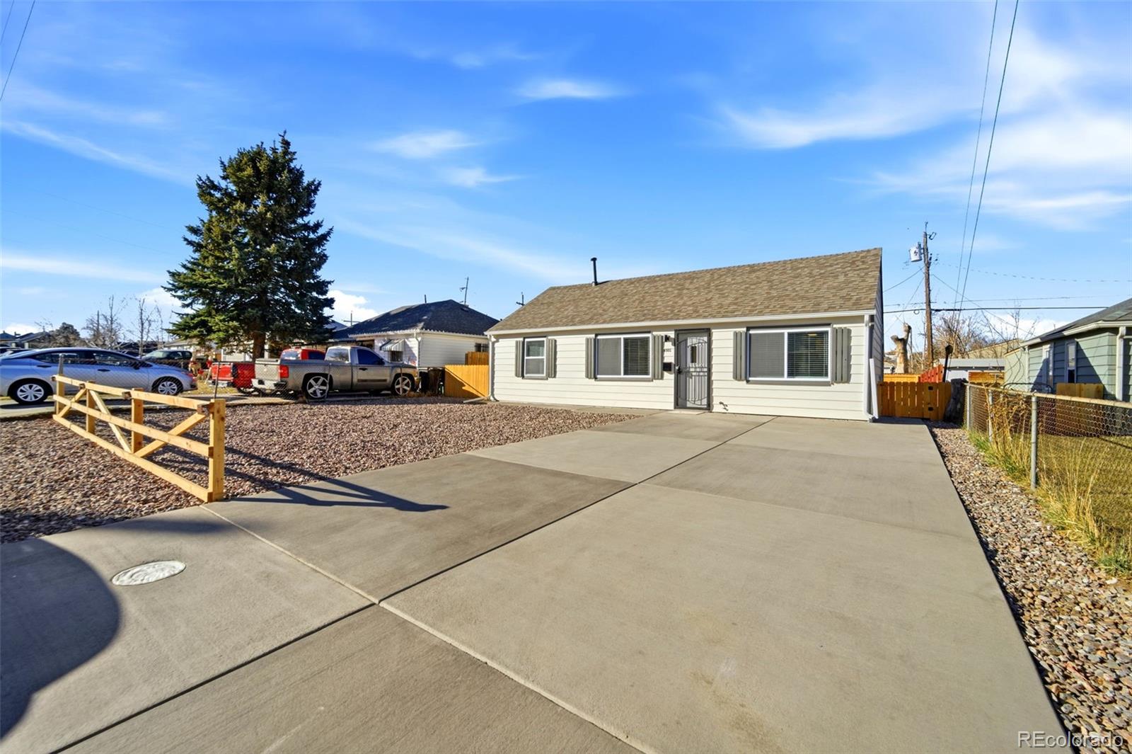 4933 Steele Street Denver, CO 80216 - Photo 2 of 31 a view of a house with sitting area