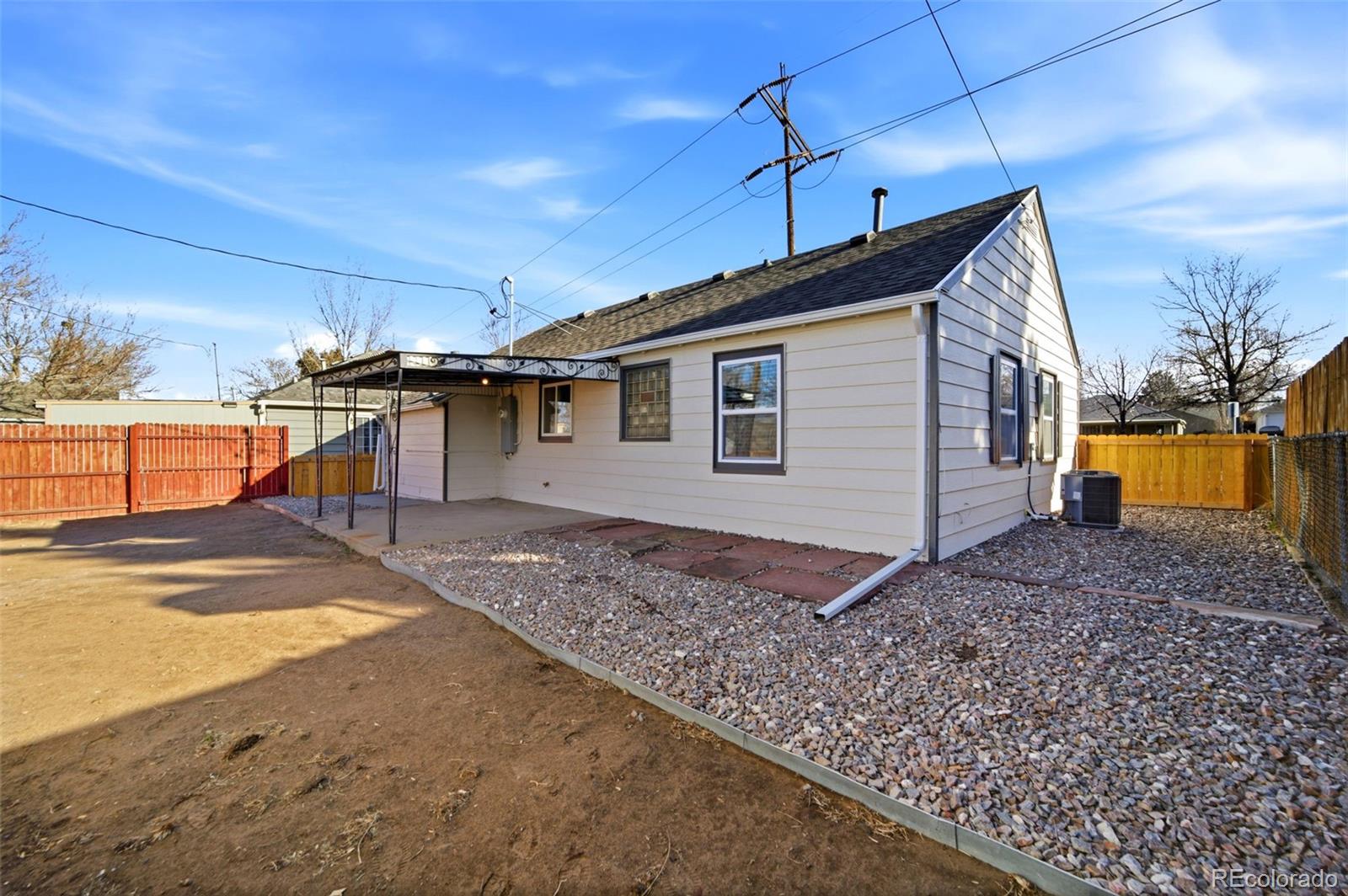 4933 Steele Street Denver, CO 80216 - Photo 23 of 31 a view of a house with a patio
