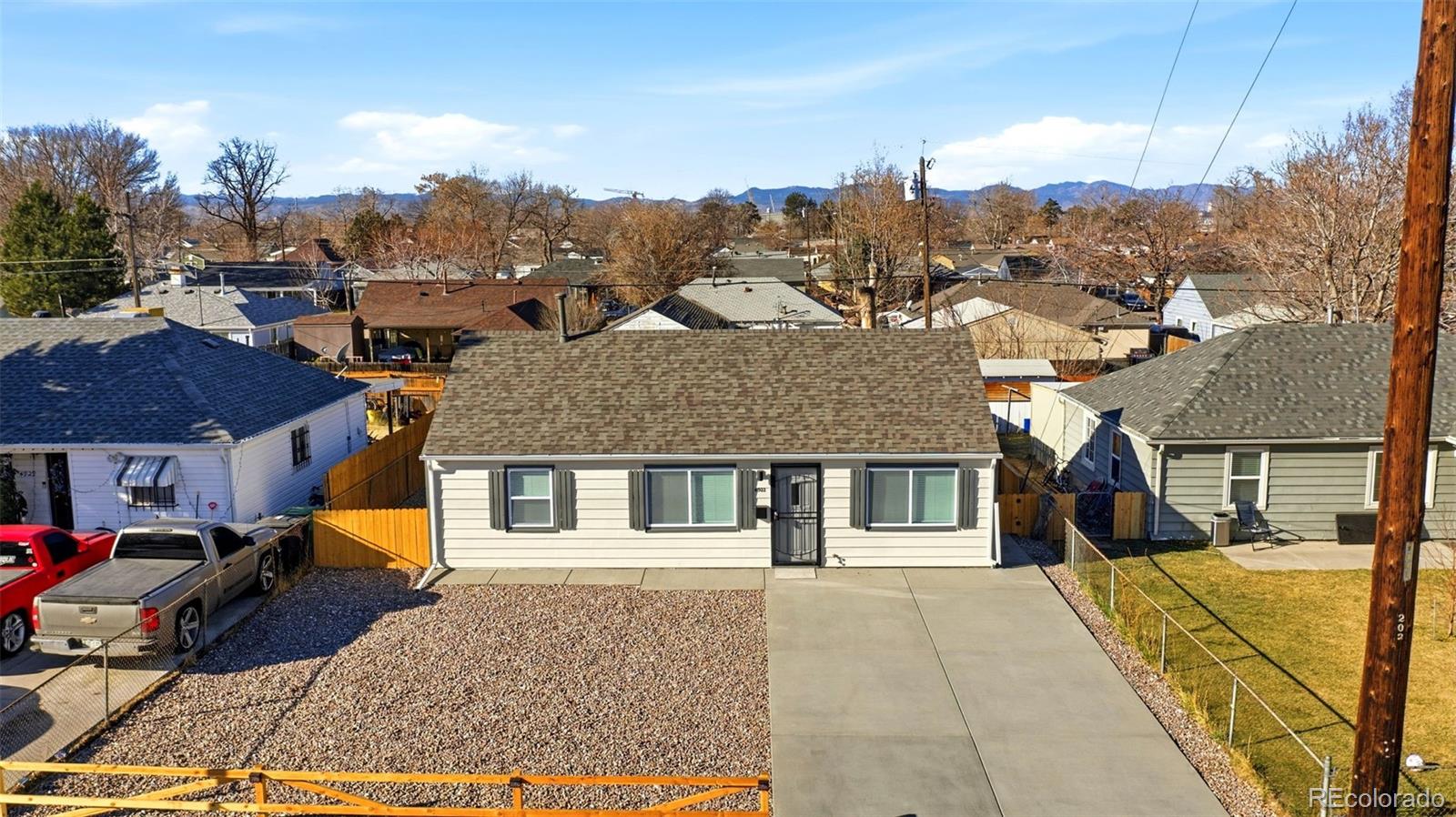 4933 Steele Street Denver, CO 80216 - Photo 25 of 31 a view of a house with a backyard