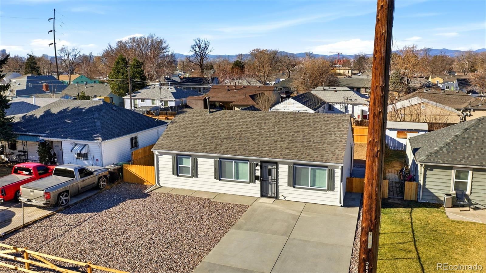 4933 Steele Street Denver, CO 80216 - Photo 27 of 31 a view of a town with many windows