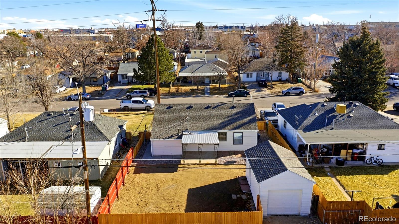 4933 Steele Street Denver, CO 80216 - Photo 28 of 31 a view of a building with outdoor space