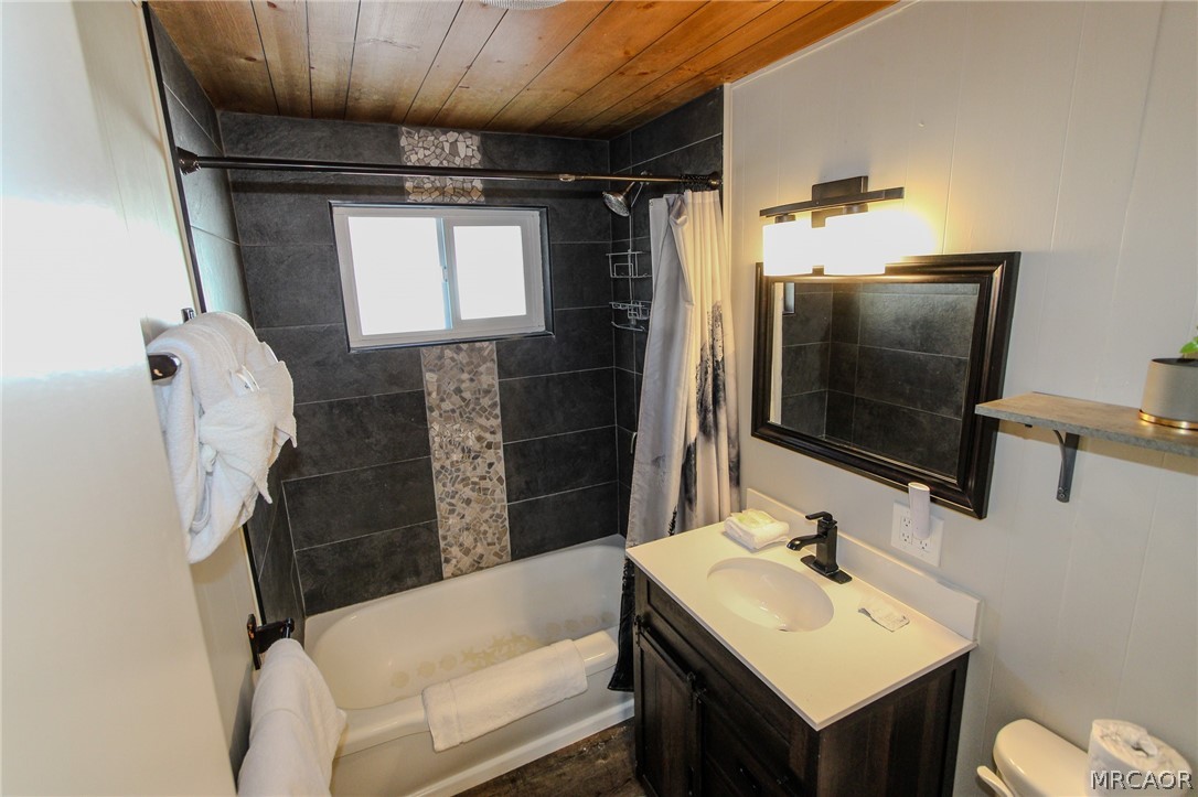 42830 Cougar Road, Unit UPPR Big Bear Lake, CA 92315 - Photo 12 of 21 a bathroom with a sink toilet and shower