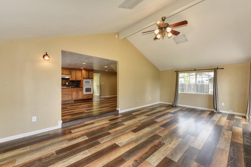 4524 Salmon Falls Road Pilot Hill, CA 95664 - Photo 19 of 47 a view of an empty room with wooden floor and a window