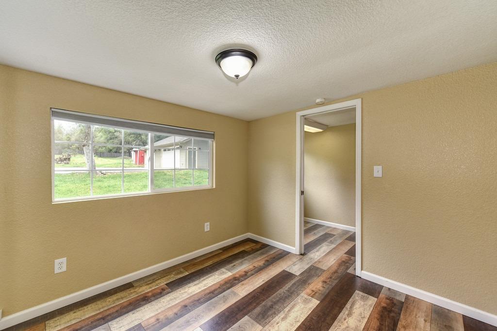 4524 Salmon Falls Road Pilot Hill, CA 95664 - Photo 32 of 47 a bedroom with bed and a window