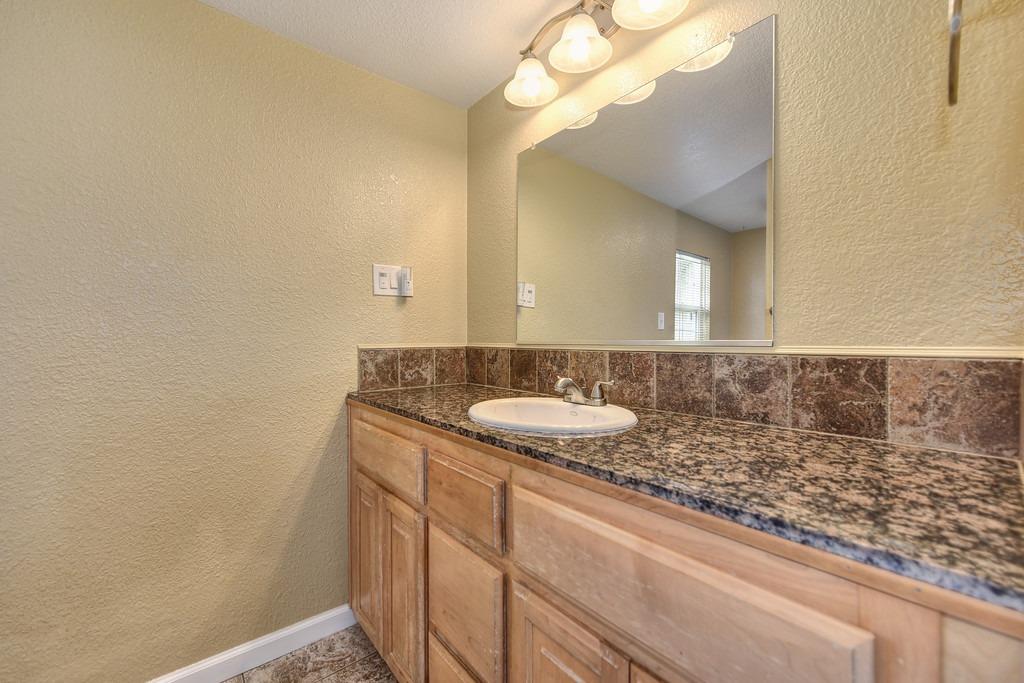 4524 Salmon Falls Road Pilot Hill, CA 95664 - Photo 33 of 47 a bathroom with a sink and a mirror