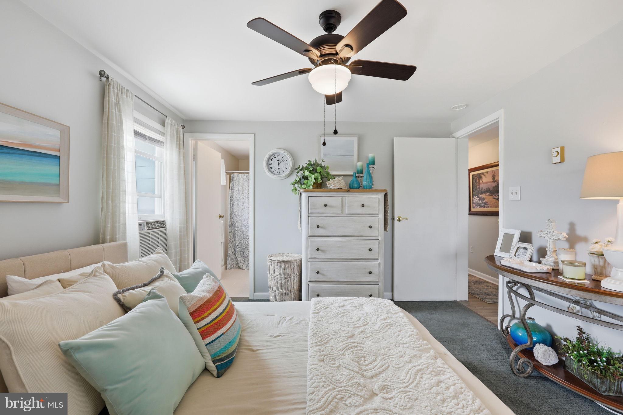 173 Cove Road Newport, NJ 08345 - Photo 25 of 72 a bedroom with a bed and a chandelier