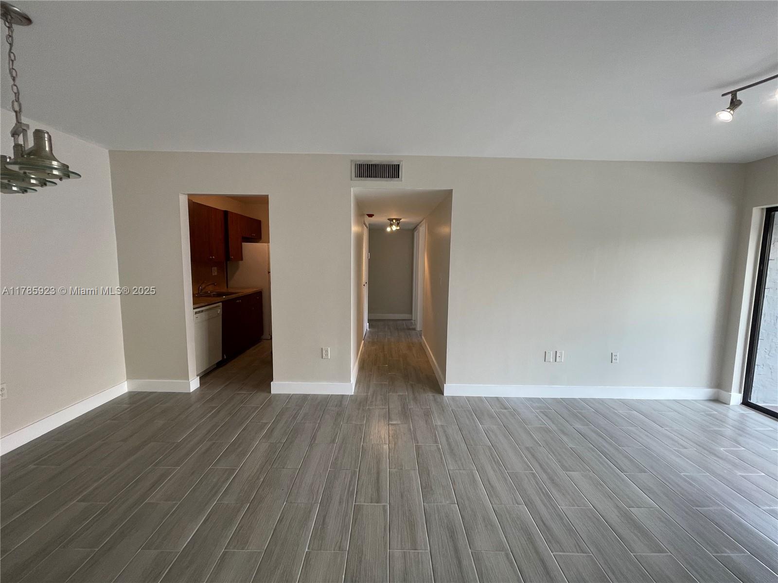 West End Miami, FL 33193 - Photo 4 of 12 a view of a big room with wooden floor and closet
