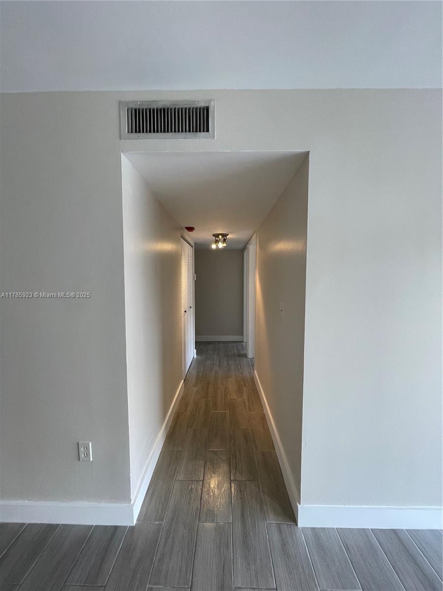 West End Miami, FL 33193 - Photo 5 of 12 a view of a hallway with wooden floor