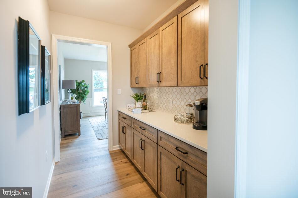 0 Marys Way, Unit ESSINGTON Harrisburg, PA 17112 - Photo 13 of 29 a kitchen with stainless steel appliances a white cabinets and wooden floor