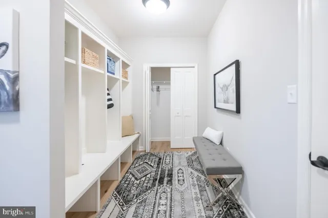 a bathroom with a sink toilet and a mirror