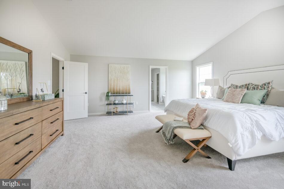 0 Marys Way, Unit ESSINGTON Harrisburg, PA 17112 - Photo 18 of 29 a spacious bedroom with a bed and a dresser in it