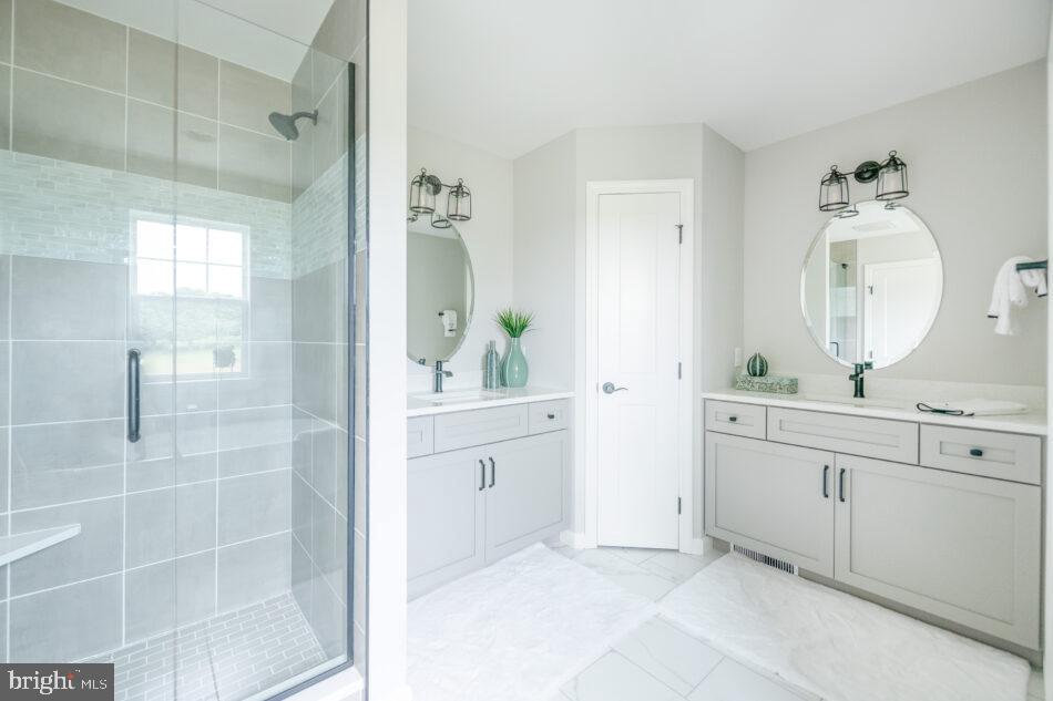 0 Marys Way, Unit ESSINGTON Harrisburg, PA 17112 - Photo 19 of 29 a spacious bathroom with a double vanity sink mirror and bathtub