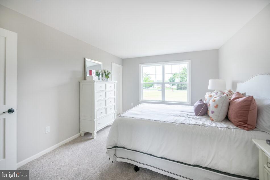 0 Marys Way, Unit ESSINGTON Harrisburg, PA 17112 - Photo 22 of 29 a bedroom with a large bed and a window