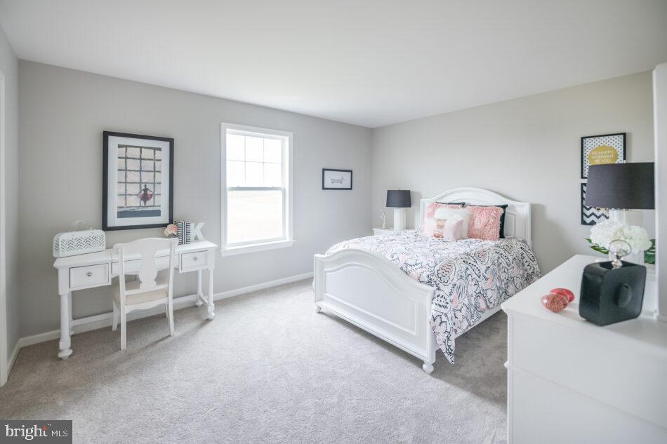 0 Marys Way, Unit ESSINGTON Harrisburg, PA 17112 - Photo 23 of 29 a bedroom with a bed and a table chair