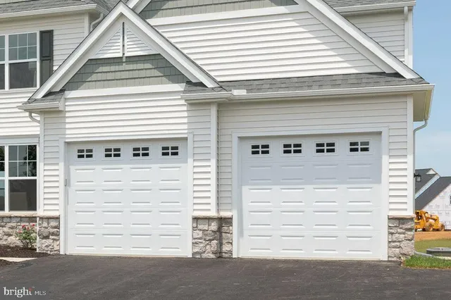 a view of multiple houses with yard