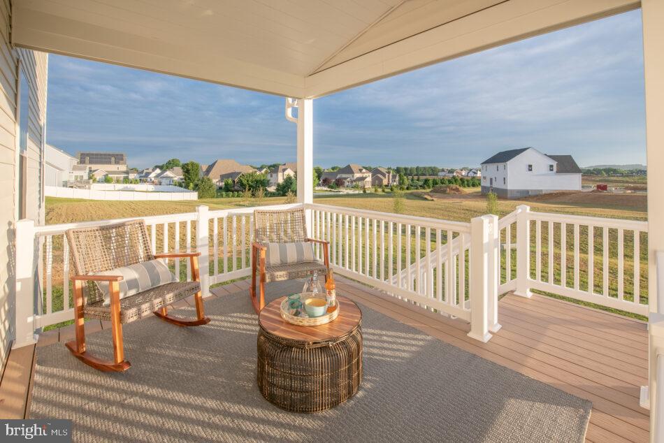 0 Marys Way, Unit ESSINGTON Harrisburg, PA 17112 - Photo 29 of 29 a view of a balcony with chair and wooden floor