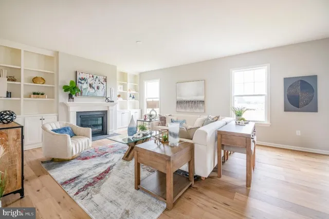 a dining room with furniture and wooden floor