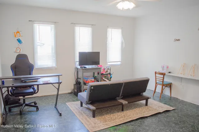 a workspace with furniture and a window