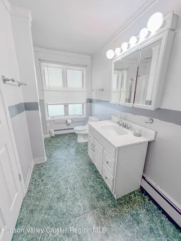 a bathroom with a sink a mirror and a bathtub