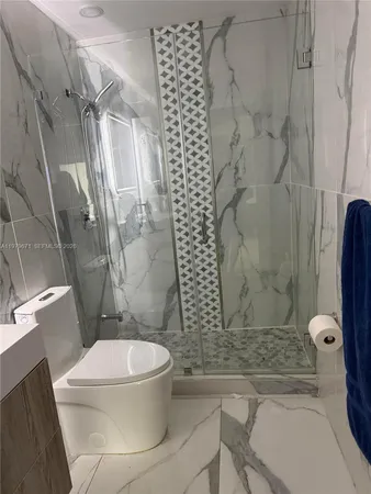 a view of a street with palm trees