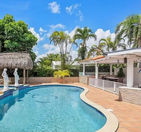 a view of a swimming pool with a patio