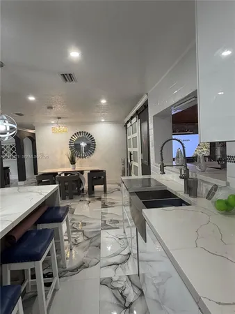 a living room with lots of furniture and a dining table