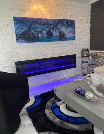 a living room with furniture and a lamp