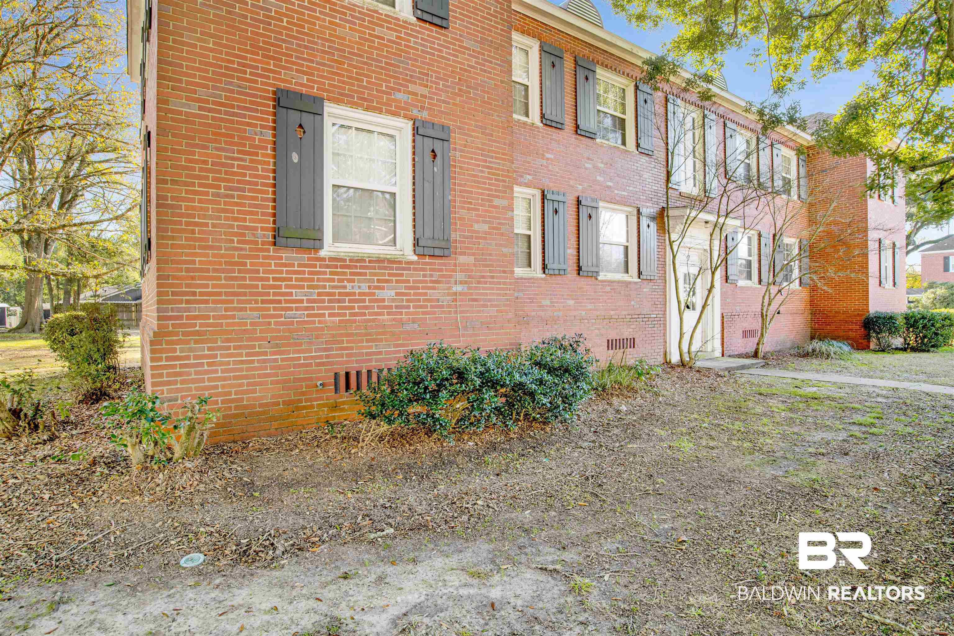 214 Upham Street, Unit 7A Mobile, AL 36607 - Photo 24 of 35 View of property exterior with crawl space and brick siding