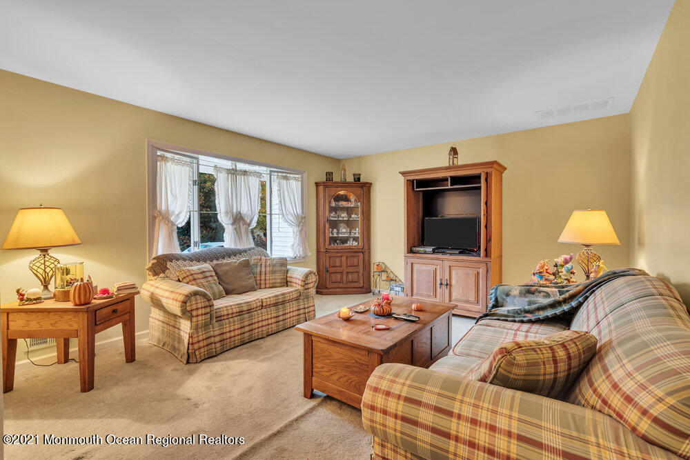146 Cedar Swamp Road Jackson, NJ 08527 - Photo 13 of 48 a living room with furniture and a flat screen tv