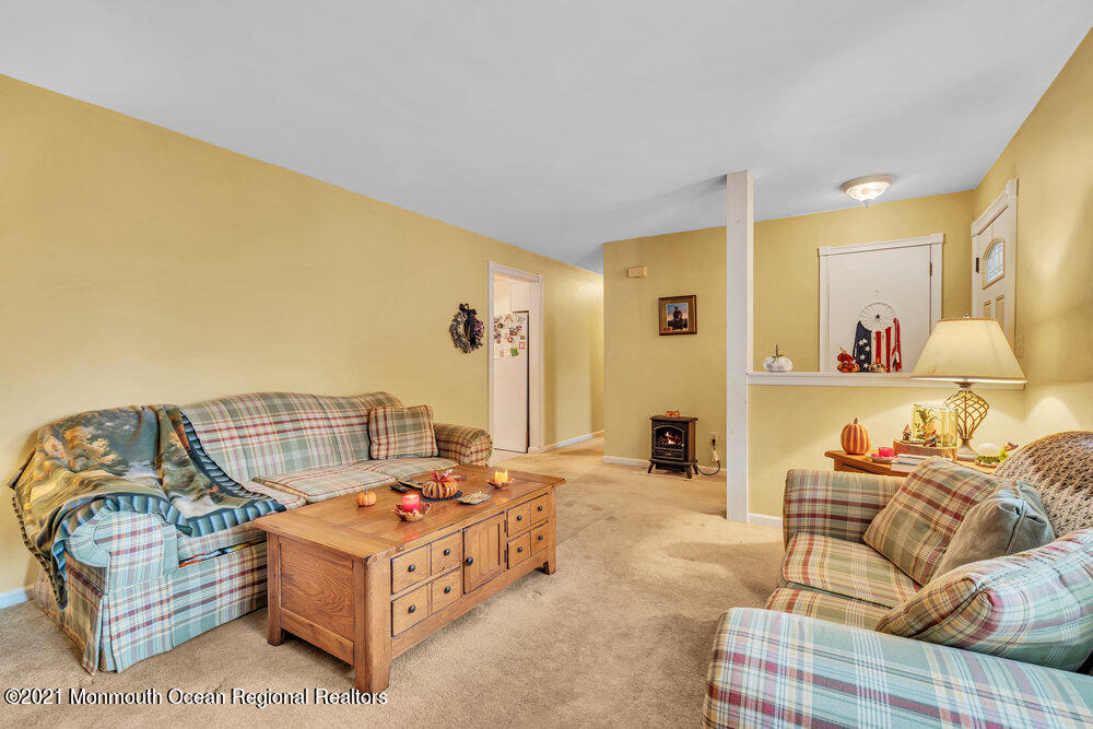 146 Cedar Swamp Road Jackson, NJ 08527 - Photo 15 of 48 a bedroom with furniture and a wooden floor
