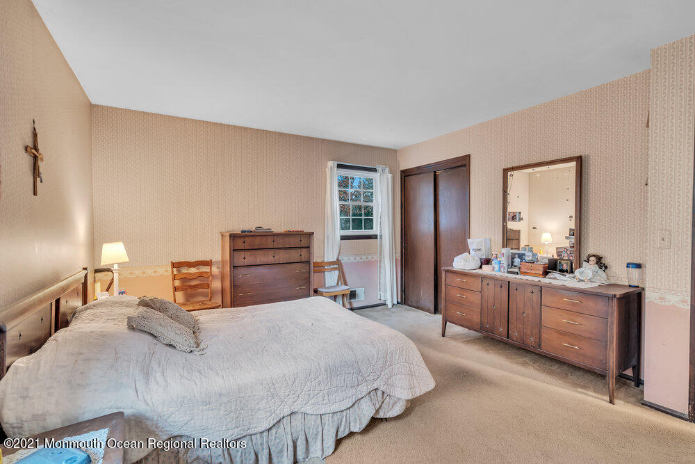 146 Cedar Swamp Road Jackson, NJ 08527 - Photo 19 of 48 a bedroom with a bed and dresser