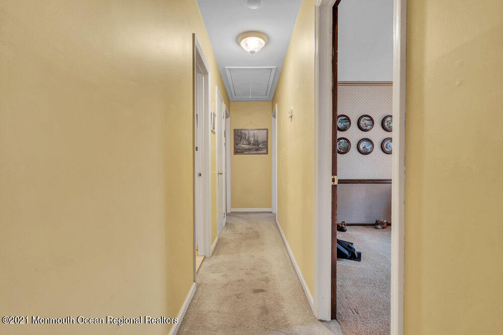 146 Cedar Swamp Road Jackson, NJ 08527 - Photo 23 of 48 a view of a hallway with wooden floor