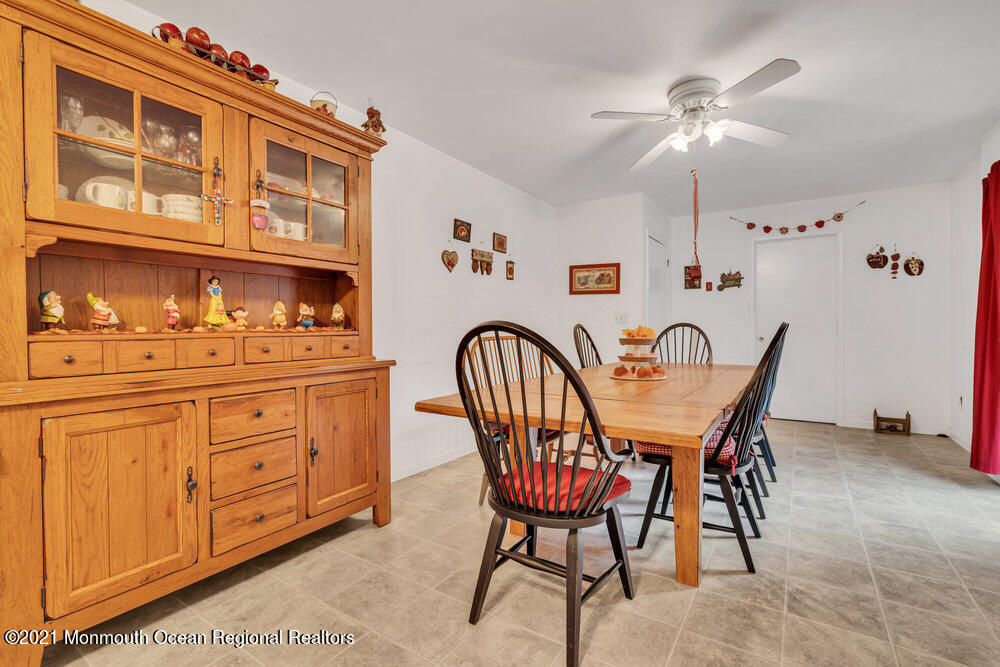 146 Cedar Swamp Road Jackson, NJ 08527 - Photo 25 of 48 a dining room with furniture and chandelier