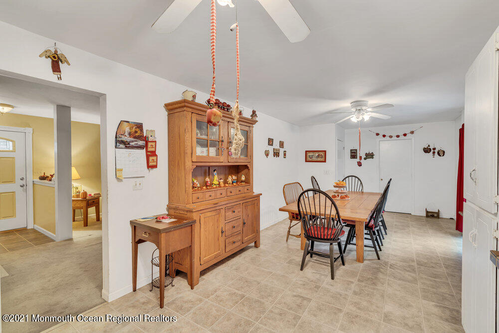 146 Cedar Swamp Road Jackson, NJ 08527 - Photo 30 of 48 a living room with furniture and a chandelier