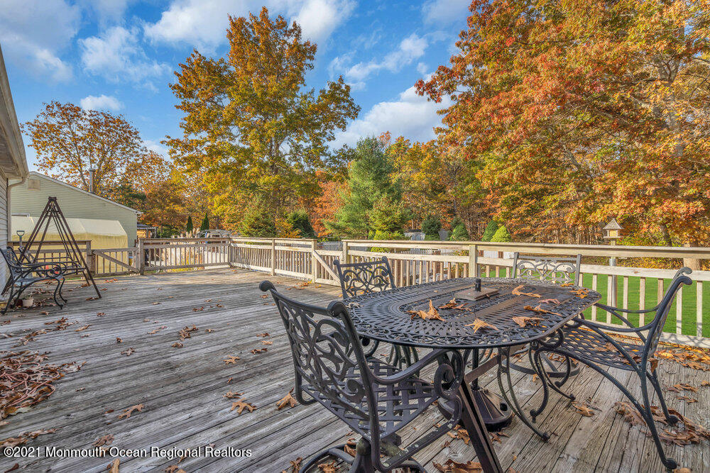 146 Cedar Swamp Road Jackson, NJ 08527 - Photo 32 of 48 a view of a chairs and table on the deck