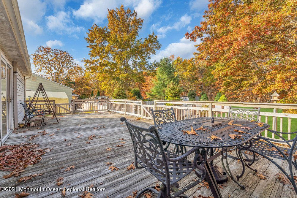 146 Cedar Swamp Road Jackson, NJ 08527 - Photo 33 of 48 a view of a chairs and table on the wooden floor