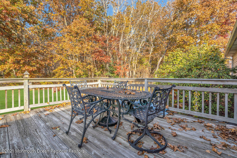 146 Cedar Swamp Road Jackson, NJ 08527 - Photo 37 of 48 a view of a chairs and table on the wooden deck