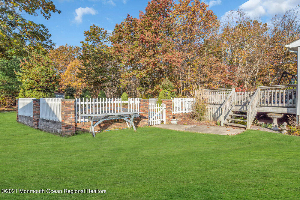 146 Cedar Swamp Road Jackson, NJ 08527 - Photo 39 of 48 a view of a chair and table and yard in the back yard
