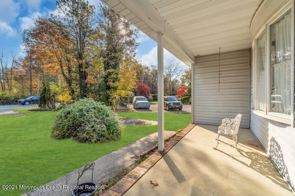 146 Cedar Swamp Road Jackson, NJ 08527 - Photo 6 of 48 a view of a chair and table in backyard of the house