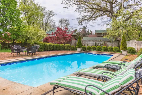 a view of a swimming pool with a lounge chairs