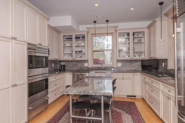 a bed room with a bed and a chandelier