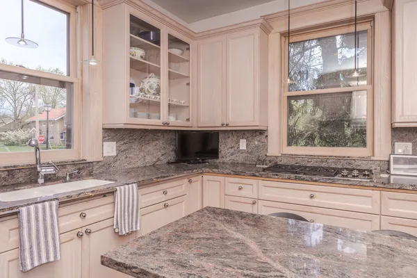 a spacious bathroom with a sink and a mirror