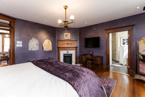 a bedroom with furniture and a window