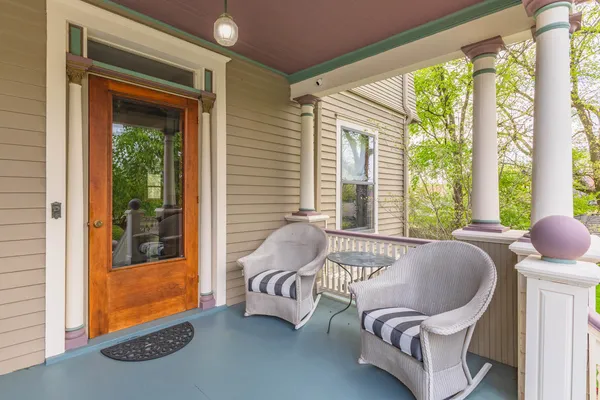 a view of a patio with a table and chairs