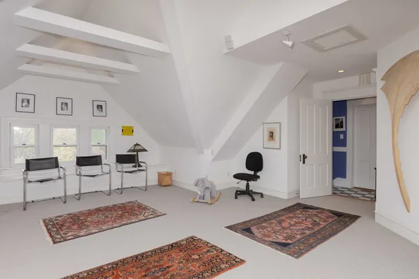 a view of a house with swimming pool and sitting area