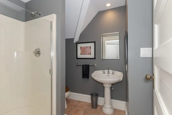 an aerial view of a house with a garden and trees