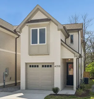 a front view of a house with a garage