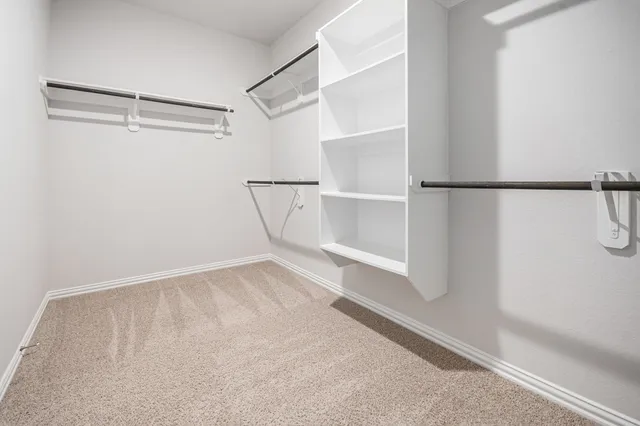 a view of an empty walk in closet